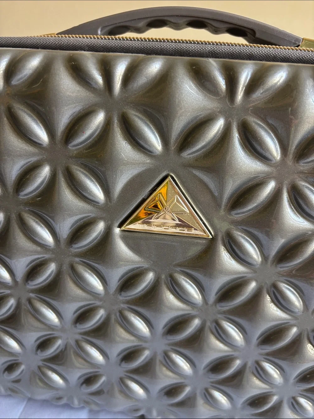 Metallic Gray Quilted Cosmetic Case with Gold Accents
